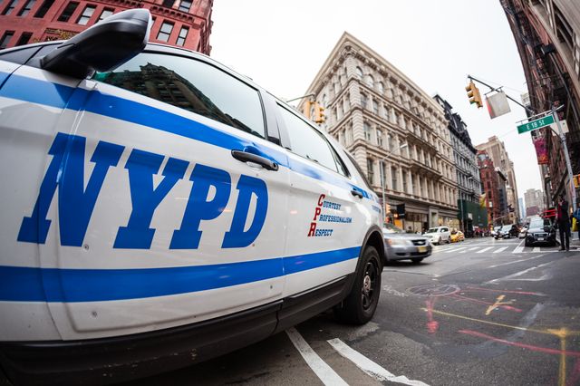 Close up of the NYPD logo on a police car.